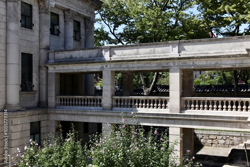 Historic Stone Courtyard and Balustrade with Blooming Flowers photo