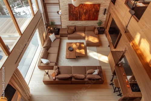 The top view of the spacious living room in the Nordic style, the brown sofa and log furniture, with the Nordic tone decoration and abstract paintings, appear fashion and modern.