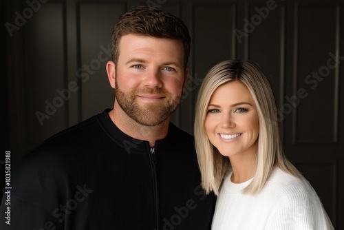 Joyful couple embracing life together in modern home setting with warm smiles