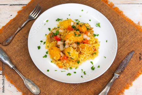 Traditional Brazilian dish rice, chicken and pequi (caryocar brasileinse) known as galinhada goiana photo