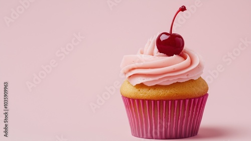 A single cupcake with pink frosting and a cherry on top, placed on a light pink background.