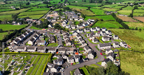 Aerial view of Residential homes, town houses, bungalows, housing, in Loughguile village Co Antrim Northern Ireland photo