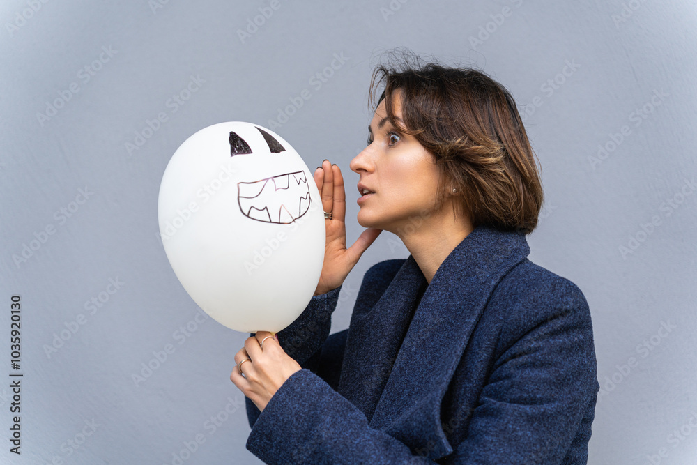woman whispering secrets to balloon with jack-o-lantern face drawing woman whispering secrets to balloon with jack-o-lantern face drawing