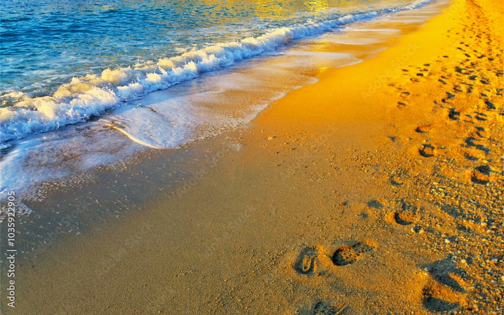 Steps in the sand by the beach with waves Steps in the sand by the beach with waves
