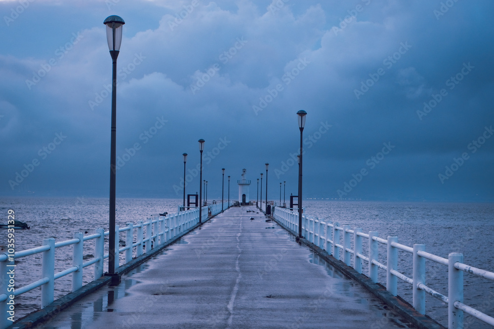 Jetty in a stormy day. Pier in the Alcochete village in Portugal Jetty in a stormy day. Pier in the Alcochete village in Portugal