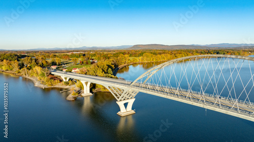 Fototapeta Naklejka Na Ścianę i Meble -  Aerial view of Lake Champlain Bridge, spanning the serene lake and connecting Crown Point, New York to Vermont.