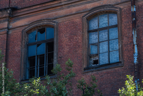 industrial background, windows of abandoned vintage factory building