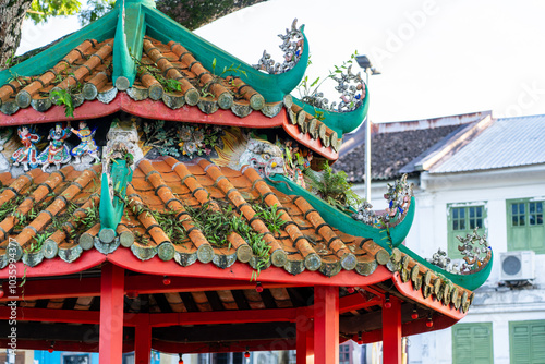 Ornate Pagoda shelter rooftop in Chinese Malay style in Malaysian Borneo. photo