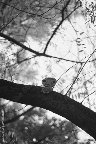 sad paper man on a tree