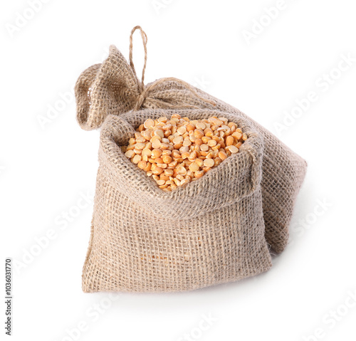 Burlap sacks with dried peas isolated on white photo