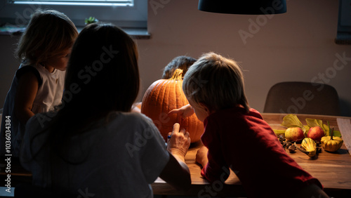 Fotografía Family haloween pumpkin carving in a cozy setting