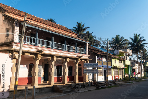 Exterior facade of an old house with traditional architecture on a street. photo