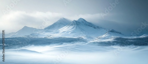 Wallpaper Mural Misty mountain range with snow-capped peaks under a clear blue sky. Torontodigital.ca