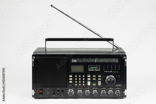 1980s Vintage Shortwave Receiver with Analog Controls and Retractable Antenna Isolated on White