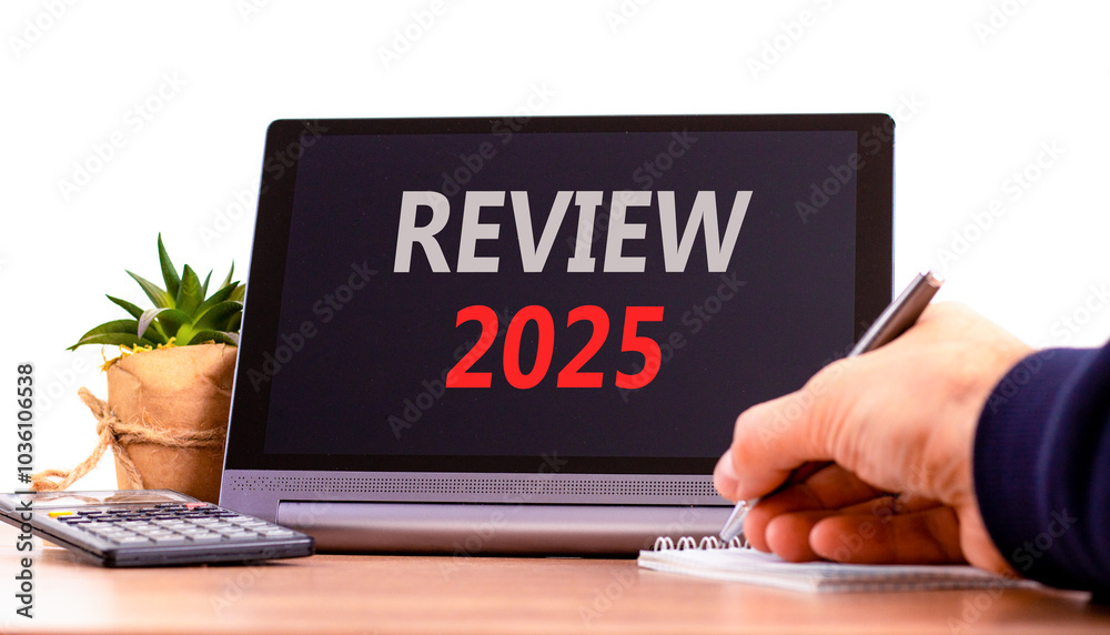 Planning review 2025 new year symbol. Concept words Review 2025 on beautiful black tablet. Beautiful white background. Businessman hand. Business review 2025 new year concept. Copy space. Planning review 2025 new year symbol. Concept words Review 2025 on beautiful black tablet. Beautiful white background. Businessman hand. Business review 2025 new year concept. Copy space.