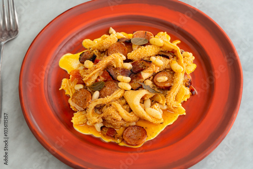 Beef tripe (bucho), beef stomach, tripe on a white plate. Dobradinha photo