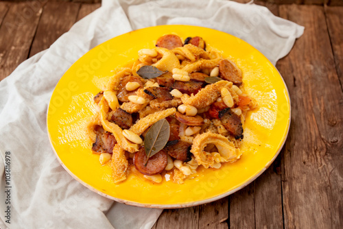 Beef tripe (bucho), beef stomach, tripe on a white plate. Dobradinha photo