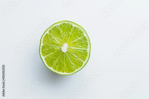 A lime half sits on a plain backdrop. Concept is freshness and simplicity. For food-related designs or healthy lifestyle content.