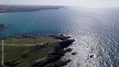 Aerial view drone of sea coast in cornwall. Rotating over the coast side in the ocean
