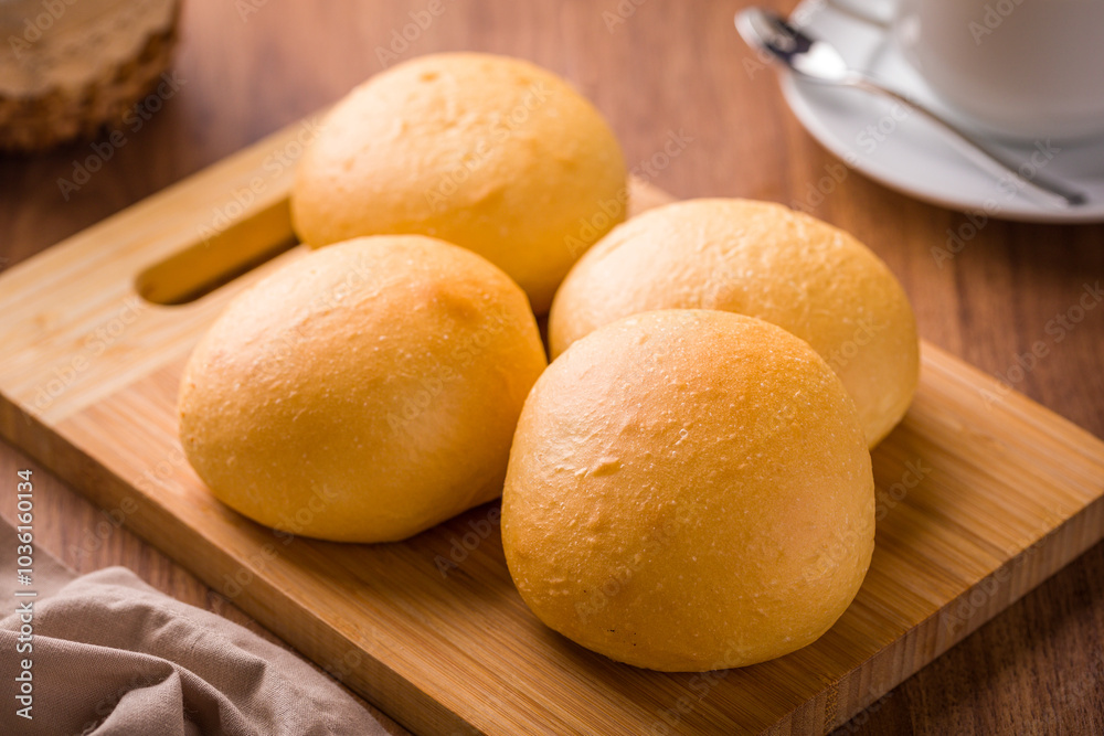 Freshly Baked Bread Rolls on Wooden Cutting Board Freshly Baked Bread Rolls on Wooden Cutting Board