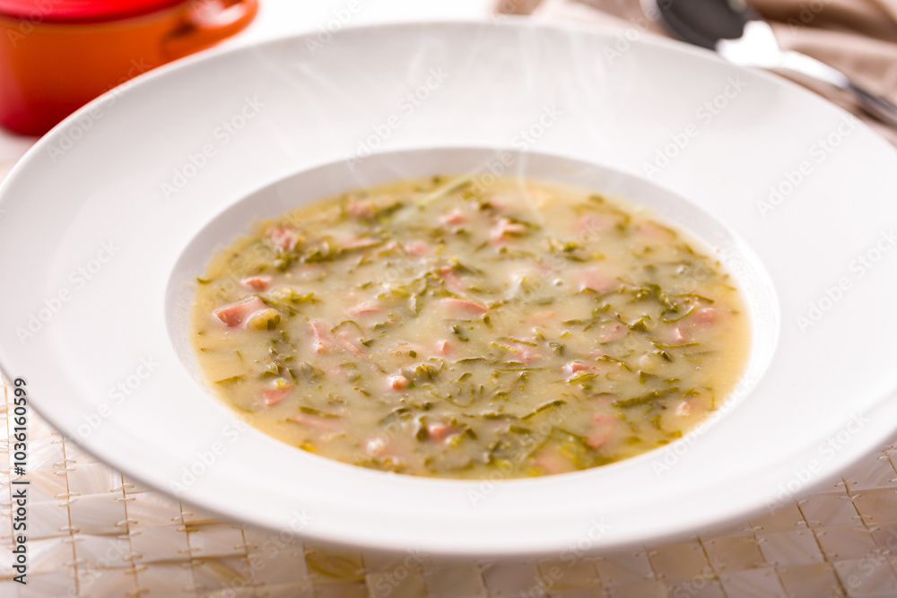 Delicious Caldo Verde Soup Served in a White Bowl Delicious Caldo Verde Soup Served in a White Bowl