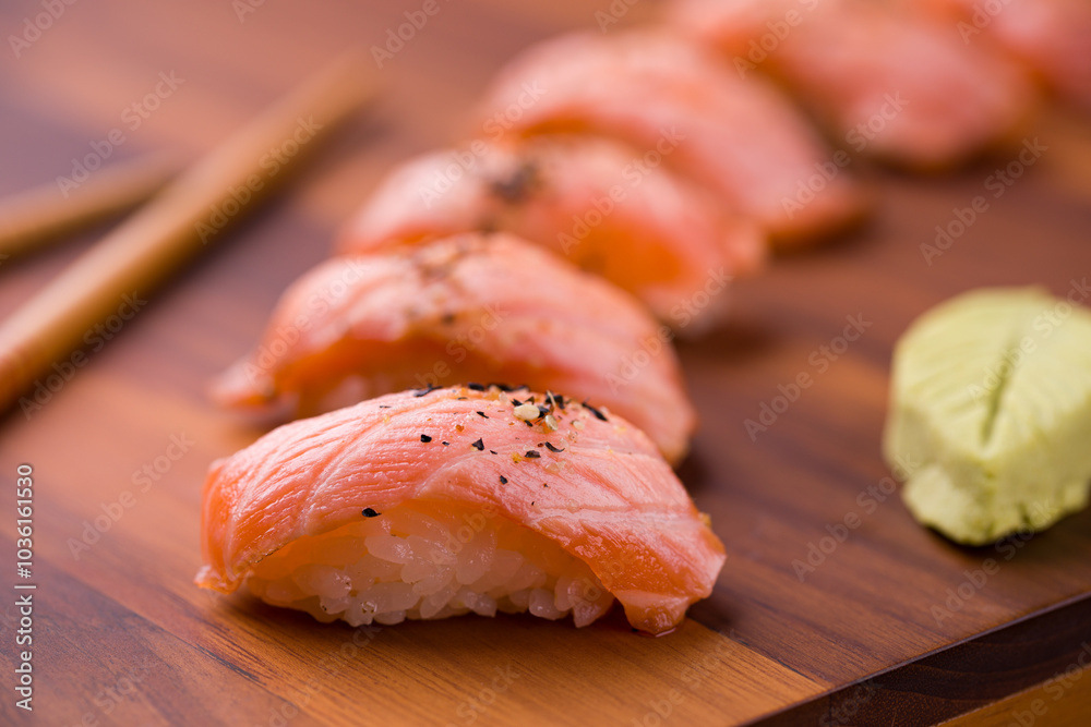 Delicious Salmon Nigiri Sushi on Wooden Serving Board Delicious Salmon Nigiri Sushi on Wooden Serving Board