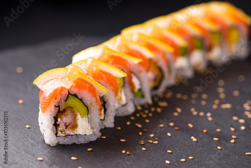 Delicious Sushi Roll With Fresh Salmon and Avocado Garnished with Lemon