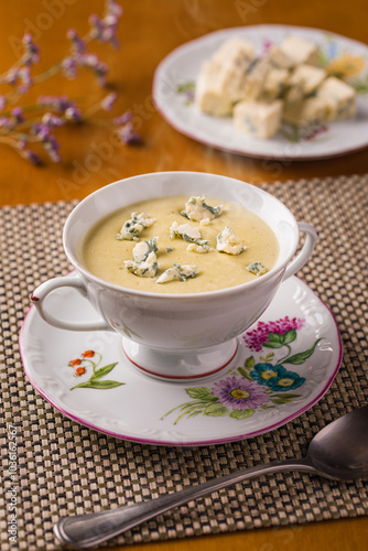 Elegant Soup Presentation With Creamy Cheese and Floral China