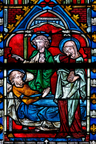 2024-10-16, Auxerre, FRANCE. Stained glass (17th century) of Death of Saint Joseph surrounded by Mary and Jesus.