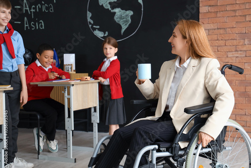 Inclusive education classroom with diverse students and teacher in wheelchair...