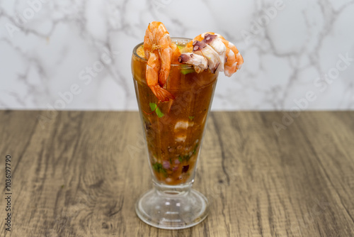 Delicious looking consome perron shrimp cocktail with octopus for a great mexican food appitizer