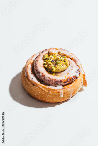 Assortment of fresh vegan cinnamon roll with pistachio toppings