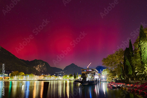 Geomagnetic storm Aurora Borealis and red SAR in Riva del Garda, Lake Garda in October 2024, Italy