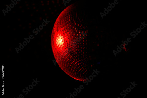 A Disco Ball Shining Red Light, Creating an Energetic Atmosphere Perfect for Celebrating