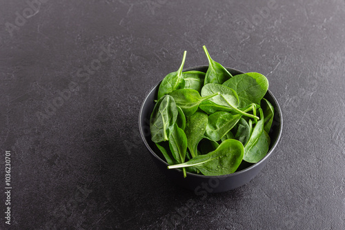 Fresh green spinach leaves in the bowl. Natural vegetarian food.