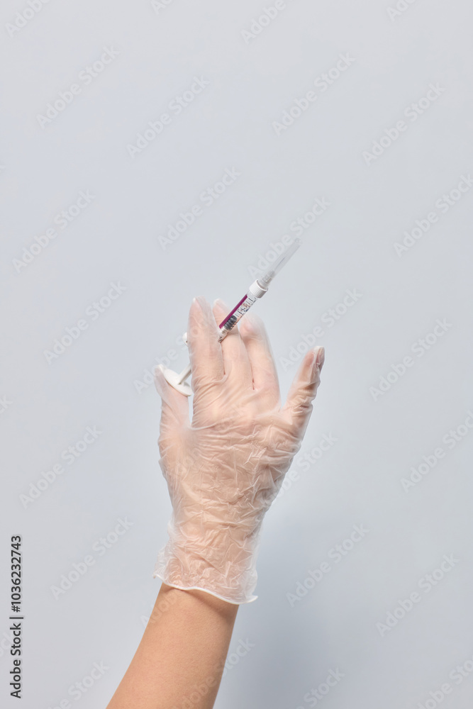 A healthcare professional giving an injection with a gloved hand for safety and hygiene A healthcare professional giving an injection with a gloved hand for safety and hygiene