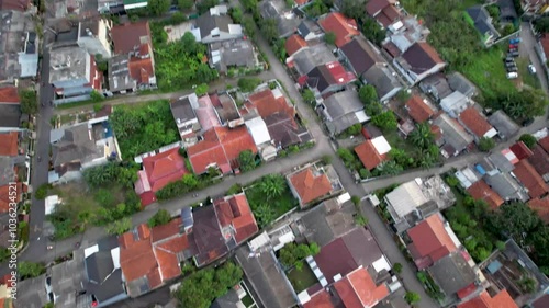 Aerial Views of A City on the Foot of Mountain in Tropical Country