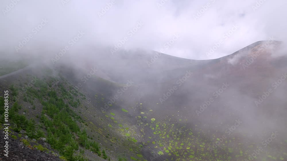 Panning left of the landscape of clouded Hoei crater on Mt.Fuji. 4k 10bit footage Panning left of the landscape of clouded Hoei crater on Mt.Fuji. 4k 10bit footage