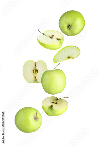 Fresh green apples in air on white background