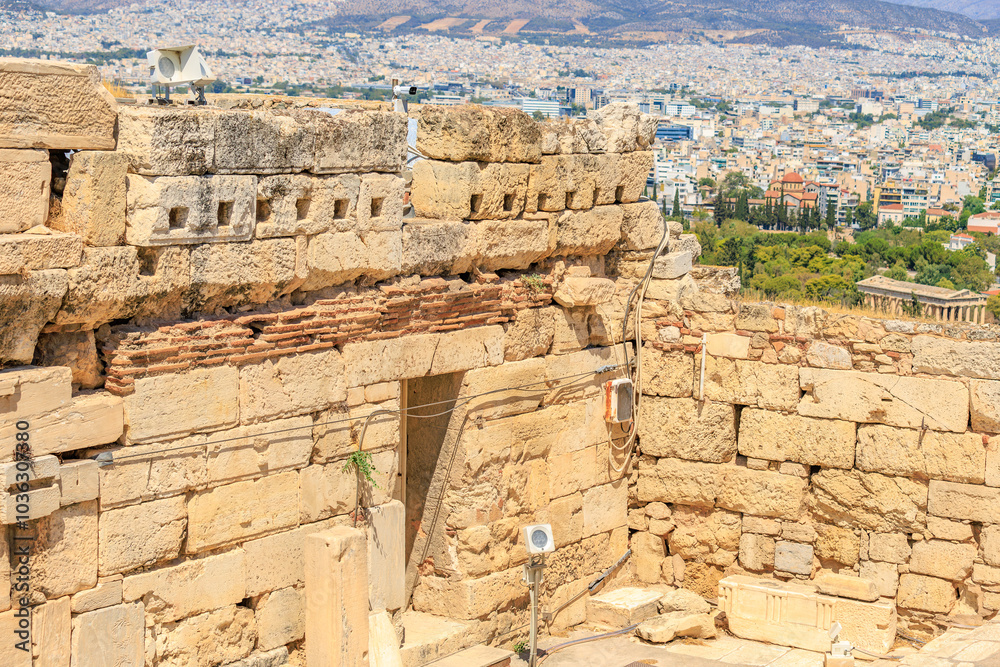 Fototapeta premium A stone building with a window and a small antenna on top, Acropolis in Athens