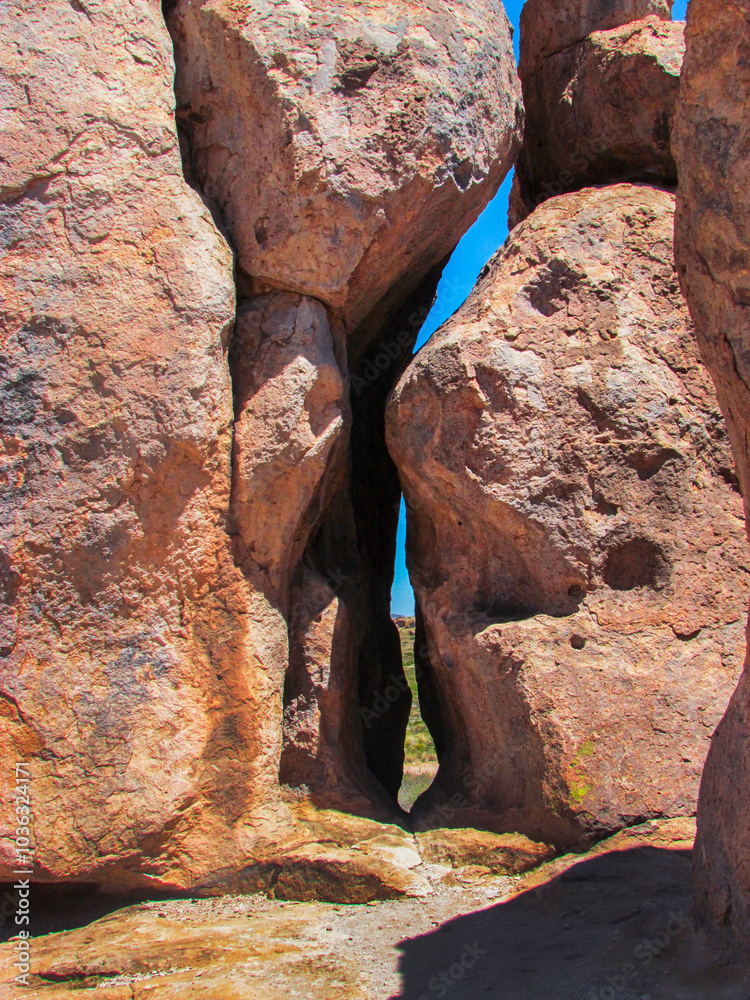 Red Rocks Stacked Standing Up Right Forming A Small Paasage Red Rocks Stacked Standing Up Right Forming A Small Paasage