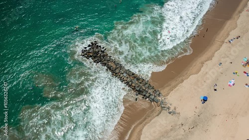 4K+ Aerial time-lapse descending and ascending rewind loop over Newport Beach jetty with waves