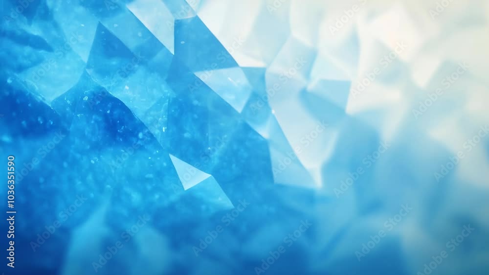 Abstract crystal-like polygonal shapes in shades of blue, forming a geometric background with a cool, icy appearance.