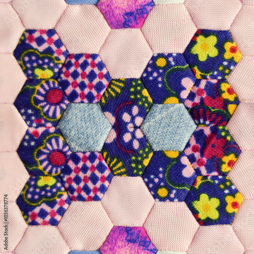 Pattern of hexagon quilt blocks sewed together to make a blanket. photo