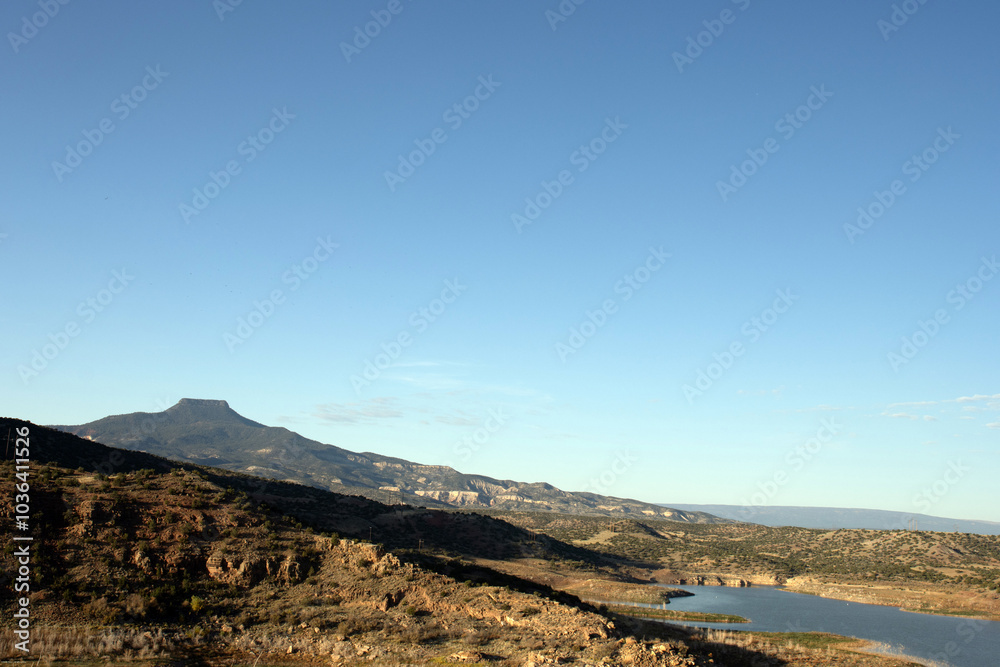 Famous landmark Cerro Pedernal looms over Abiquiu Lake, an Army Corps of Engineers reservoir in northern New Mexico, at dawn Famous landmark Cerro Pedernal looms over Abiquiu Lake, an Army Corps of Engineers reservoir in northern New Mexico, at dawn