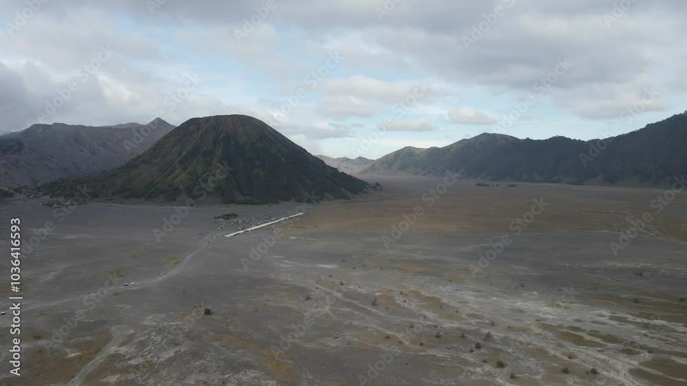 View of Mount Bromo and Mount Batok seen from a height. Bromo Tengger Semeru National Park is a very famous natural tourist area located in Probolinggo, East Java, Indonesia. View of Mount Bromo and Mount Batok seen from a height. Bromo Tengger Semeru National Park is a very famous natural tourist area located in Probolinggo, East Java, Indonesia.