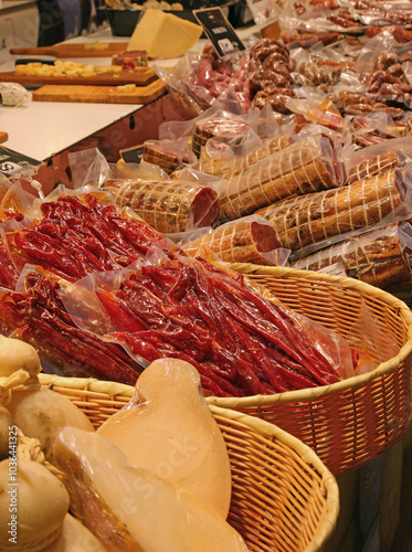 stall with many typical Italian foods including cheese cured meats and vacuum-packed meat sold at the neighborhood market photo