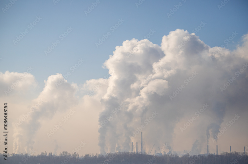 A large cloud of smoke is rising from a factory A large cloud of smoke is rising from a factory