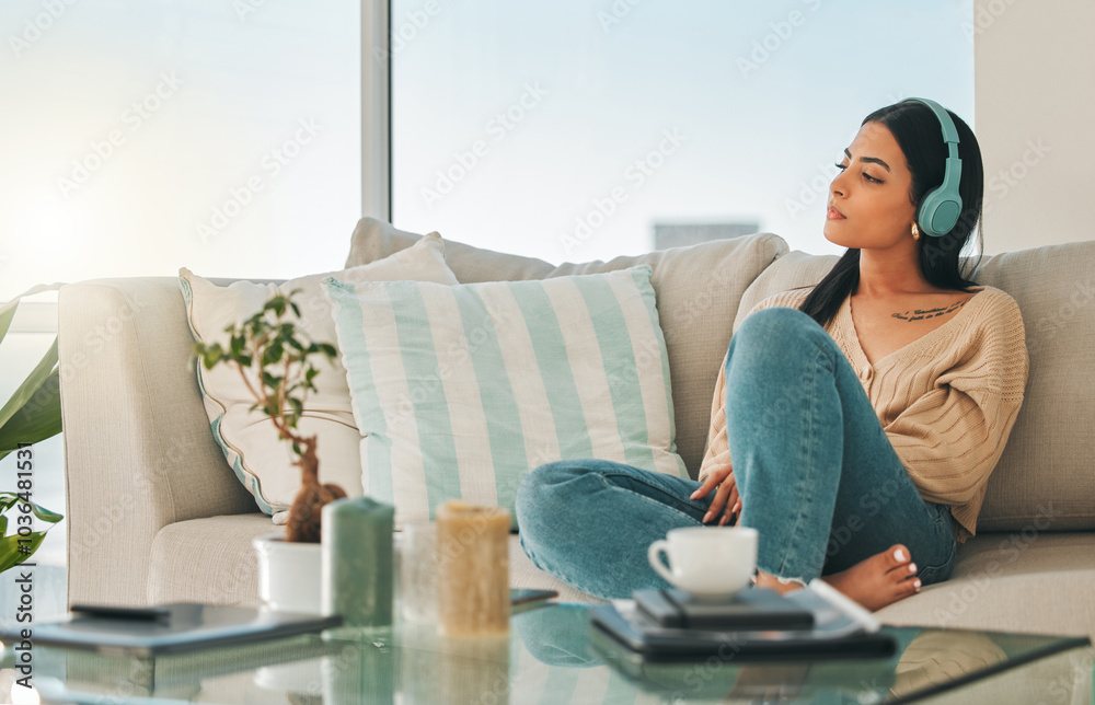 Woman, headphones and music for thinking in home, streaming and listen to podcast for reflection. Female person, hearing sound and lounge for perspective on future, weekend nostalgia and memory Woman, headphones and music for thinking in home, streaming and listen to podcast for reflection. Female person, hearing sound and lounge for perspective on future, weekend nostalgia and memory