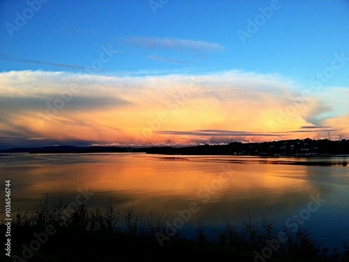 Calm waters and a colorful sunset at Fanahammeren, Norway.